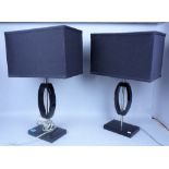 A PAIR OF MODERN BLACK GLASS AND CHROME TABLE LAMPS (2)