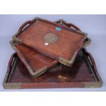 A SET OF THREE CHINESE HARDWOOD AND BRASS BOUND STACKING TRAYS