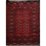 AN AFGHAN RUG, OF TURKMEN DESIGN