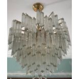 A MODERN GILT METAL AND GLASS CHANDELIER