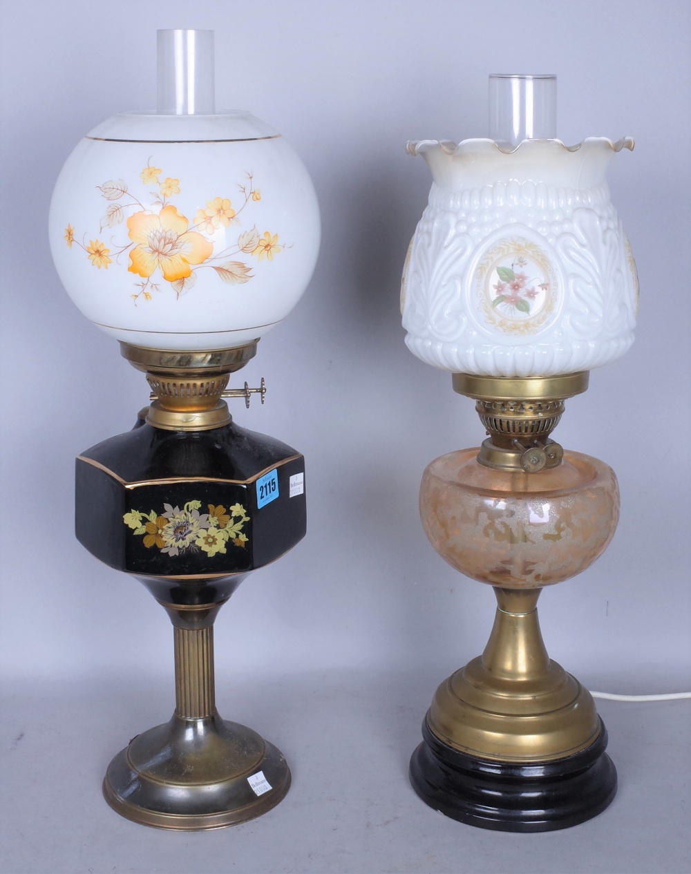 A LATE VICTORIAN GLASS OIL LAMP AND ANOTHER SIMILAR LATER (2)