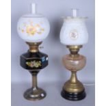 A LATE VICTORIAN GLASS OIL LAMP AND ANOTHER SIMILAR LATER (2)