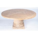 A MODERN PINE CIRCULAR DINING TABLE