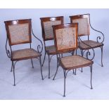 A SET OF FOUR WROUGHT IRON, HARDWOOD AND RATTAN FRENCH CAFE STYLE ARMCHAIRS (4)