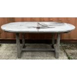 A MODERN HARDWOOD EXTENDING OVAL GARDEN TABLE