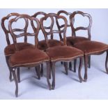 A SET OF SIX VICTORIAN WALNUT DINING CHAIRS (6)