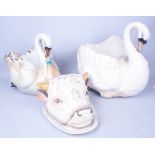 CERAMICS COMPRISING; A CONTINENTAL BUTTER DISH FORMED AS A COW, A PAIR OF SWANS AND A GROUP OF...