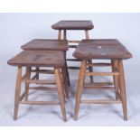 A MATCHED SET OF FIVE LOW STOOLS (5)