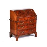 A QUEEN ANNE FIGURED WALNUT BUREAU