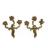 A PAIR OF ROCOCO STYLE GILT-METAL THREE-LIGHT WALL APPLIQUÉS