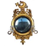 A REGENCY GILT FRAMED CONVEX GIRANDOLE MIRROR