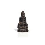 A SOUTH EAST ASIAN SILVER- COLOURED METAL BUDDHA