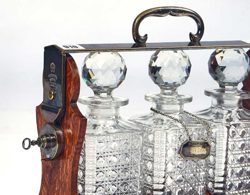 BETJEMANN’S PATENT; A LATE 19TH CENTURY SILVER PLATE AND OAK THREE BOTTLE TANTALUS - Image 3 of 4