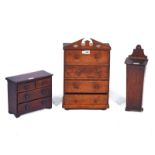 A 19TH CENTURY OAK MINIATURE CHEST OF FOUR DRAWERS (3)