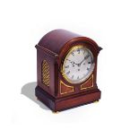 AN EDWARDIAN MAHOGANY QUARTER-CHIMING MANTEL CLOCK