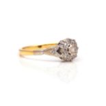 AN 18CT GOLD AND DIAMOND NINE STONE CLUSTER RING
