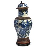 A CHINESE BLUE AND WHITE CRACKLE GLAZED VASE AND COVER