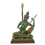 A PATINATED & GILT BRONZE MODEL OF A THAI MUSICIAN