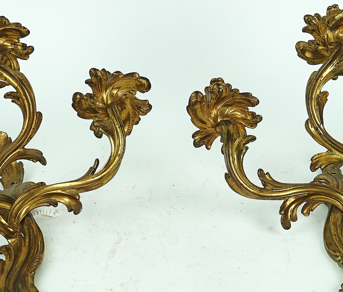 A PAIR OF ROCOCO STYLE GILT-METAL THREE-LIGHT WALL APPLIQUÉS - Image 2 of 2