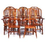 A SET OF EIGHT EARLY 19TH CENTURY YEW AND ELM WINDSOR CHAIRS (8)