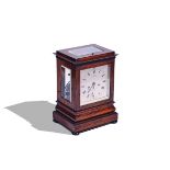 A LATE REGENCY ROSEWOOD FOUR-GLASS MANTEL CLOCK