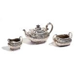 A SILVER THREE-PIECE TEA SET