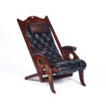 A CAMPAIGN STYLE BRASS MOUNTED MAHOGANY ARMCHAIR