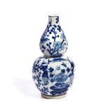 A CHINESE BLUE AND WHITE GOURD SHAPED VASE