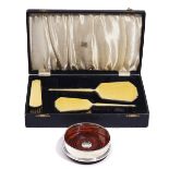 A SILVER AND YELLOW ENAMELLED THREE PIECE COMPOSITE DRESSING SET AND A SILVER MOUNTED BOTTLE...