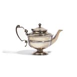 A LATE VICTORIAN SILVER TEAPOT