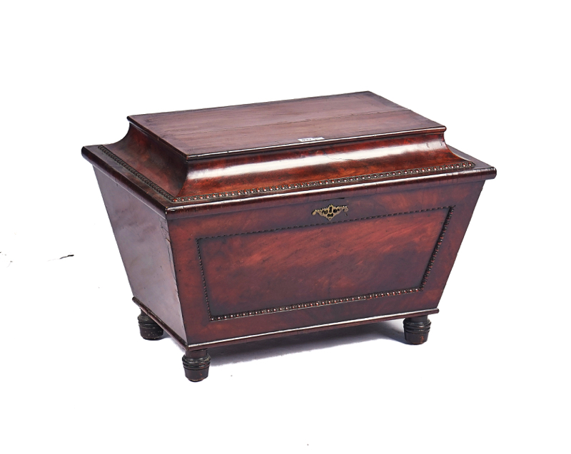 A REGENCY MAHOGANY SARCOPHAGUS FORM CELLARETTE