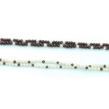 A GARNET BEAD AND CULTURED PEARL NECKLACE