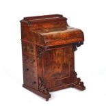 A VICTORIAN FIGURED WALNUT POP UP PIANO TOP DAVENPORT