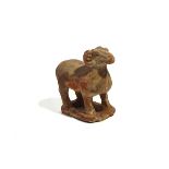 A CHINESE POTTERY FIGURE OF A RAM