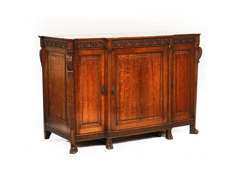 AN 18TH CENTURY STYLE OAK BREAKFRONT SIDE CABINET