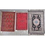 AN INDIAN RUG, BLACK FIELD WITH PINK MEDALLION (3)