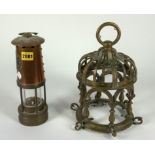 AN EARLY 20TH CENTURY COPPER MINER'S LANTERN AND AN UNUSUAL BRONZE HANGING LIGHT FITTING