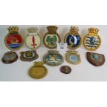 A collection of 12 vintage ships and naval plaques in cast plaster including Ocelot, Brilliant,