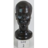 A particularly fine carved Ebony African head almost life size: 34cm tall.