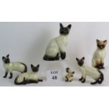 Six pottery Siamese cat figurines including by makers Royal Doulton, Beswick and Wurttemberg.