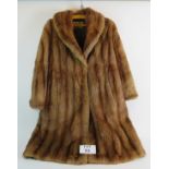 A vintage Arthur Shaw fur coat, probably mink, fully lined, overall length: 99cm.
