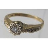 A 9ct gold ring set with centre diamond