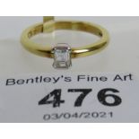 An 18ct yellow gold baguette cut diamond