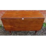 A Victorian mahogany drop leaf dining ta