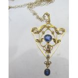 A yellow metal open work pendant, in the