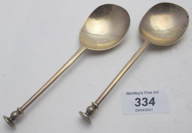 A pair of silver seal top spoons, London