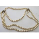 An unusual double strand pearl necklace,