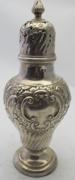A weighted embossed silver caster of bal