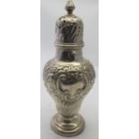 A weighted embossed silver caster of bal