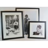 Three framed black and white photographi